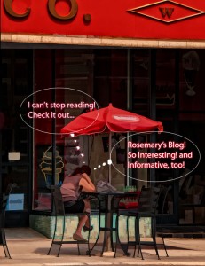Reading Rosemary's blogs at Woolworth's a young woman reads at a table with a red umbrella