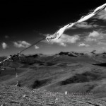 prayer flags fly over Himalayas