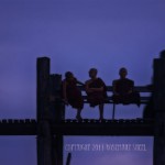 Monks on U Bein Bridge silhouette of monks sitting on U Bein Bridge