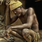 member of Mossi tribe wears a hat made of cowrie shells and goat horns