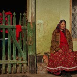 Romania: portrait of a gypsy woman at her home Romania: portrait of a gypsy woman at her home