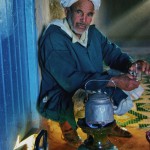 Desert Berber making tea in his home