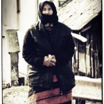romanian peasant woman wearing opinci and leg cloths