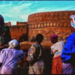 Burkina Faso Guerunsi village with women painting designs on houses