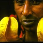close up of Fulani woman wearing huge gold earrings