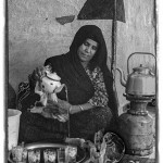 a Berber woman pours tea