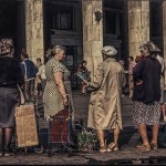 Women stand at the entrance to Moscow's subway with home made items for sale.