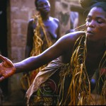 A woman draped in vines dances herself into a trance
