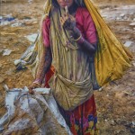 A young Rabari ragpicker hesitates as her photo is taken.