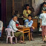 Burmese relax in a small teahouse near the Yangon river quay.