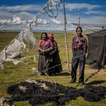 A Tibetan family outside their yak hair tent